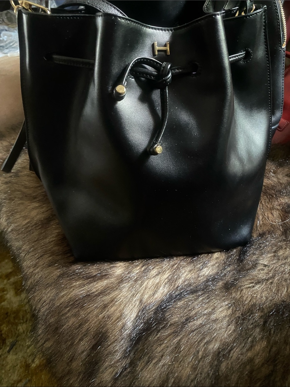Black Drawstring Halston Bucket Bag with Gold Accents